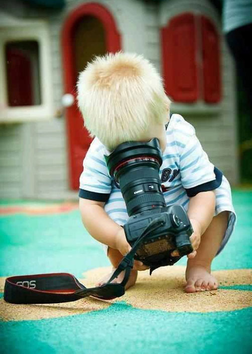 funny baby with camera photo